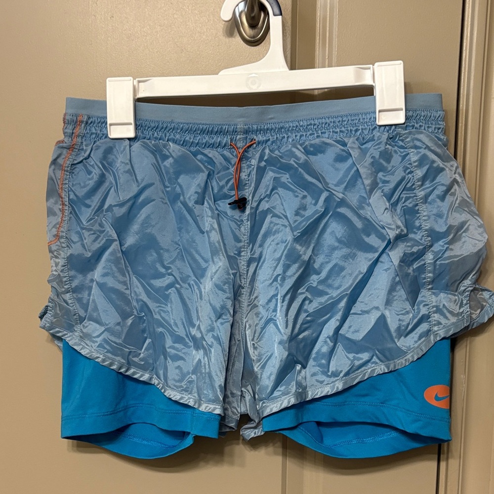 Nike Sky Blue Athletic Shorts with Orange Details